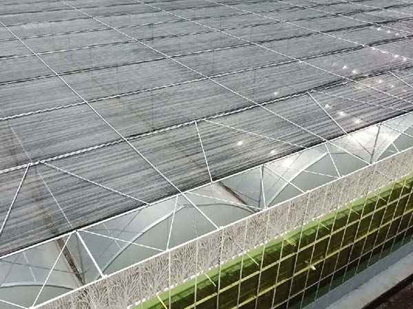 External shading system on a multi-span greenhouse