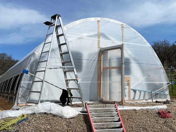 Internal light-dep greenhouse with polytunnel outside